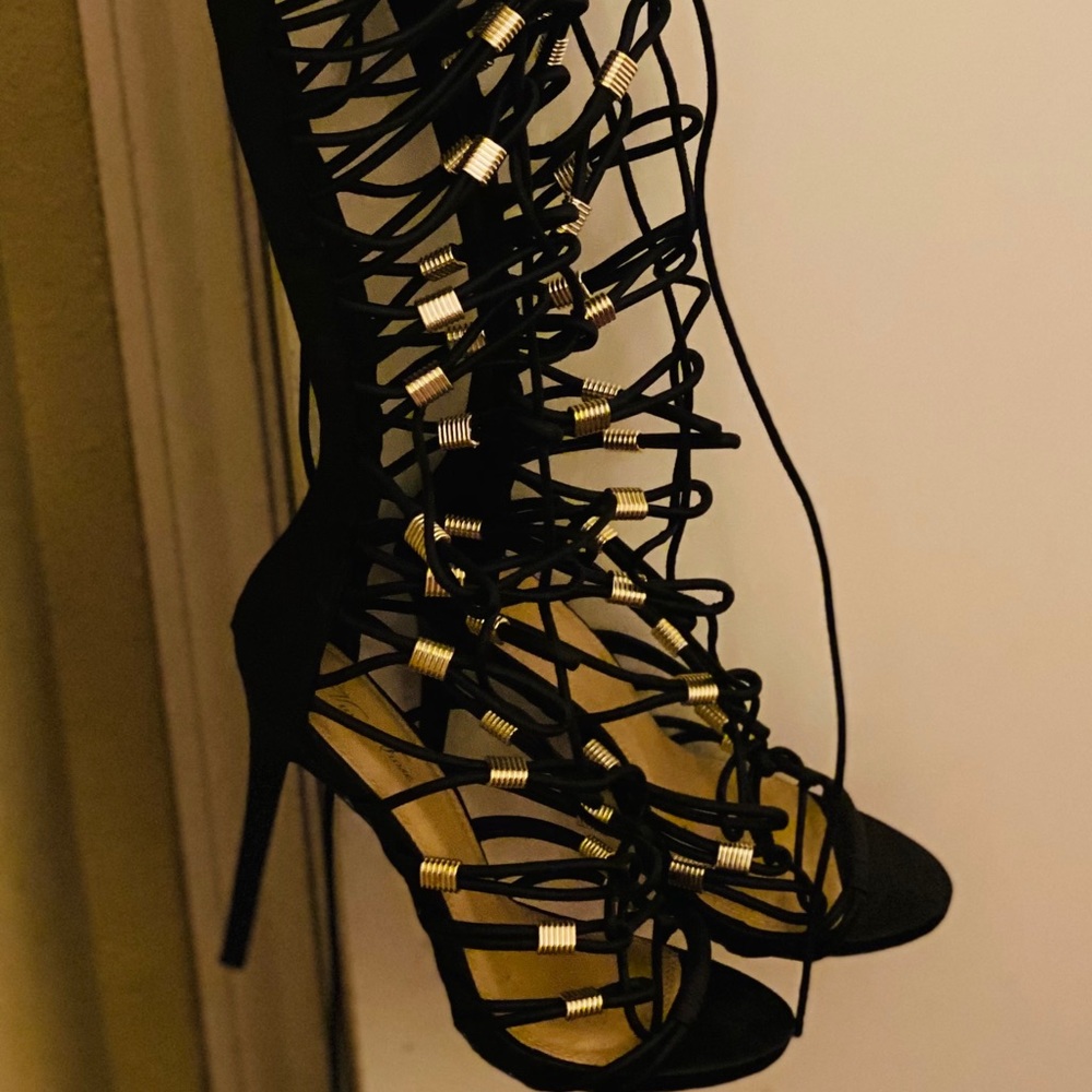 Fashionable Strap up boots w/gold embellishments
